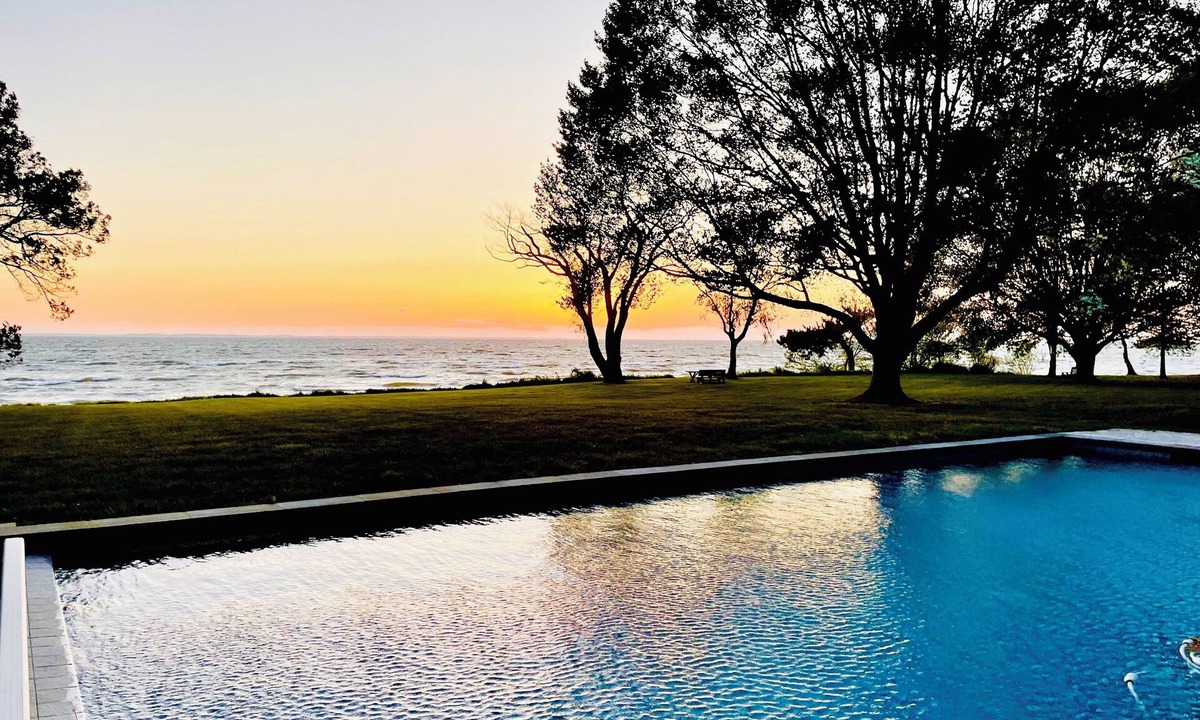 Rock Hall House | A stunning Chesapeake Bay sunset from a beautiful home with an inground pool!