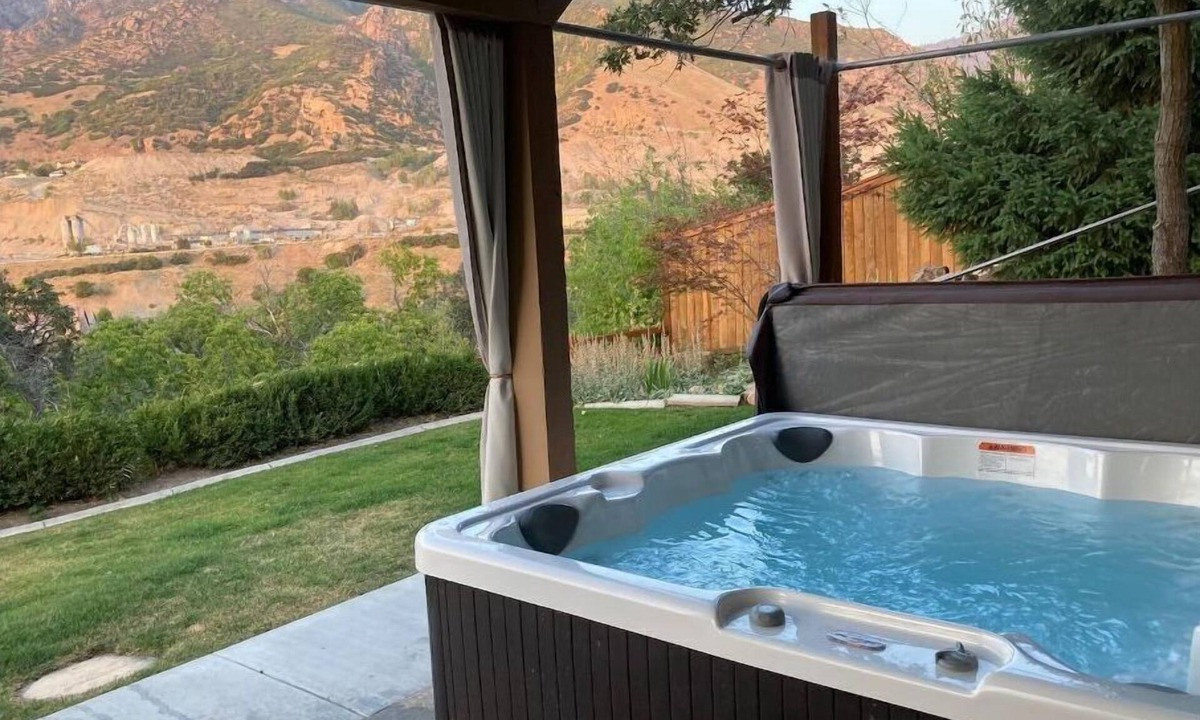 Cottonwood Heights Apartment | City and Mountain Views from a Private Hot Tub + King Bed!