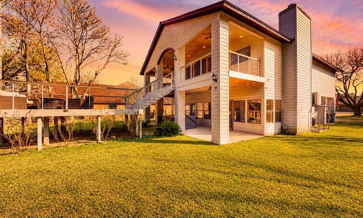 McQueeney House | Lakefront home with hot tub, dock, kayaks, central AC, & great lake views