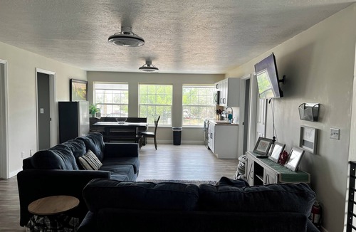 Emery County House | 8 Bedroom 6 Bathroom home with kitchen, dining room area and lounge.