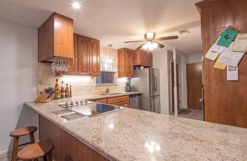 New Braunfels House | Bohemian Hill: NB Cypress-Lined Guadalupe Riverfront + Main & Guest House + Shady Decks & Backyard