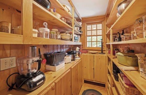Holderness House | Central Escape is a spacious Lakes Region retreat just 5 minutes from downtown Meredith, less than a mile to Squam Lake and 20 minutes to concerts at the Bank of New Hampshire Pavilion. Enjoy the private year-round hot tub, fire pit, yard games!