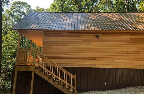 Winslow Cabin | Farmer cabin is nestled in our little woodland village – playground, pond & more