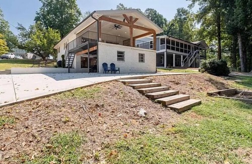 Buford House | Lake Lanier Luxury Water Front Retreat with Large Dock, Boat Rental & Lake Views