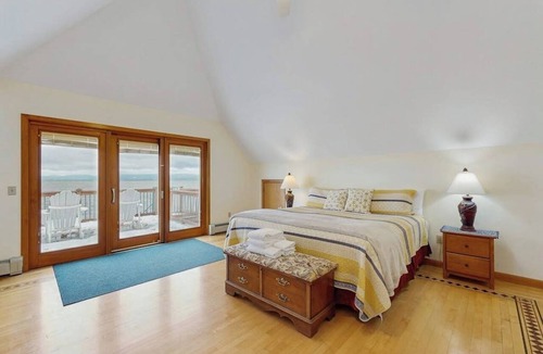 Malletts Bay House | Lakefront home with water access, views of the mountains, private deck & patio