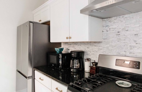 Lancaster House | Modern City home with off street parking, fenced backyard