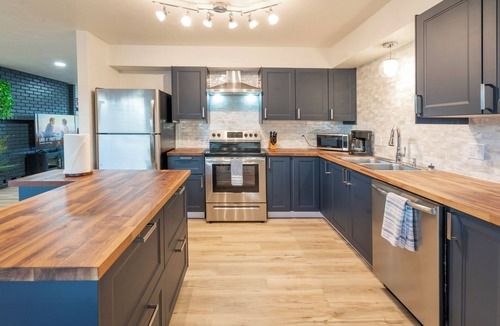 Page House | Modern retreat with games room in central location!