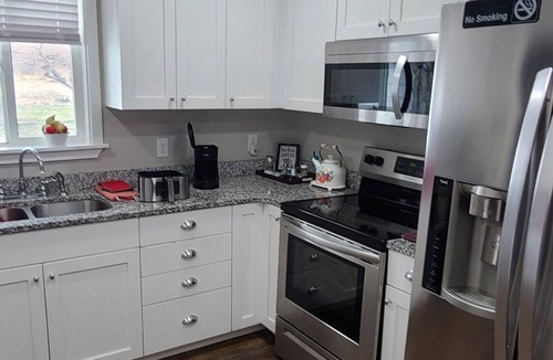 Price House | Nana's Place is a beautiful family, pet-friendly home with a fenced back yard.