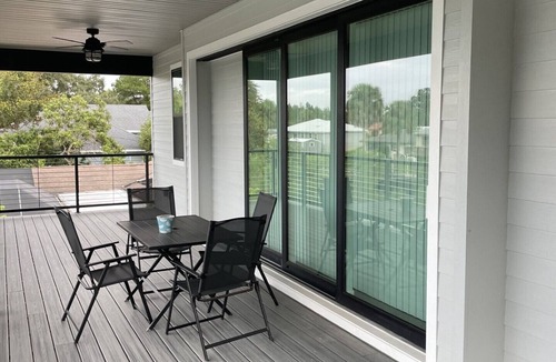 Indian Waters House | New Stilt Home on quiet canal with wrap around porch.