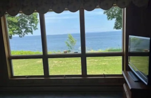 Cumberland Head House | Private waterfront retreat on Cumberland Head where every sunrise paints the sky