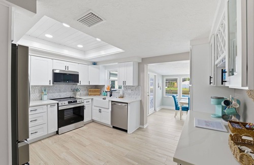 Tropic Shores House | Remodeled Waterfront Home Heated Saltwater Pool & Spa With Gulf Access