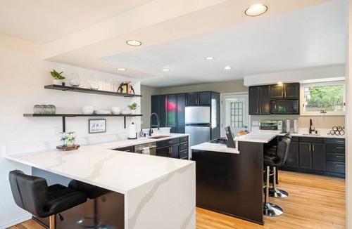 Lake Forest Park House | Renovated 4BR retreat near Seattle with patio, sport court, foosball room & lake views for families