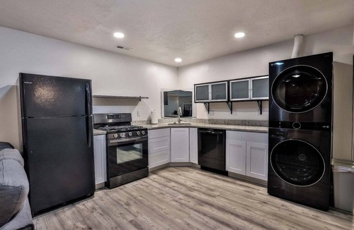 Draper House | Spend your days exploring the mountains, come home and soak in the hot tub, grill on the deck, reconnect with family and friends in the thoughtfully designed comfortable retreat with both intimate and large gathering spaces.