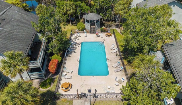 Experience the best of St. Simons Island from this bright and breezy coastal condo, perfectly located to beach, shops and dining.