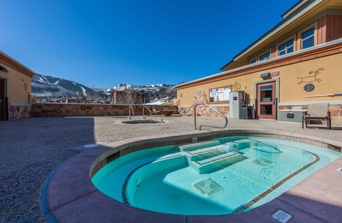 Park City Condo | Walk Out from your private patio to the pool, hot tub, fire pit and lawn - superior summer home C001