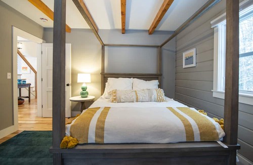 Jericho House | Woodlands: Luxury Vermont log cabin with sweeping views of field and forest.