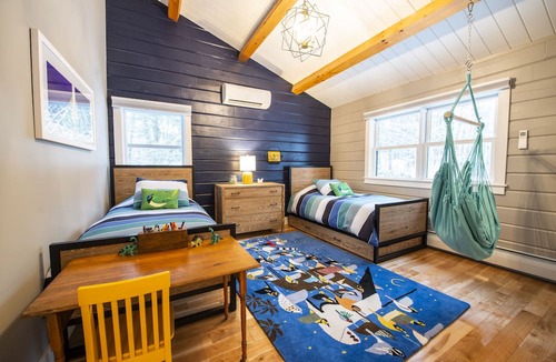 Jericho House | Woodlands: Luxury Vermont log cabin with sweeping views of field and forest.