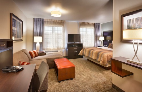 Midvale Apartment | King Suite | Heated Pool & Hot Tub. Free Breakfast Buffet. Near Jordan Landing!